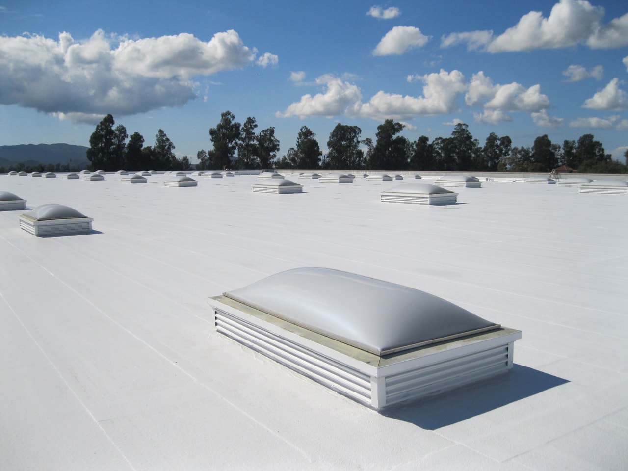 Midland commercial building after TPO roof installation - Energy-efficient white membrane roofing - 5 Star Commercial Roofing