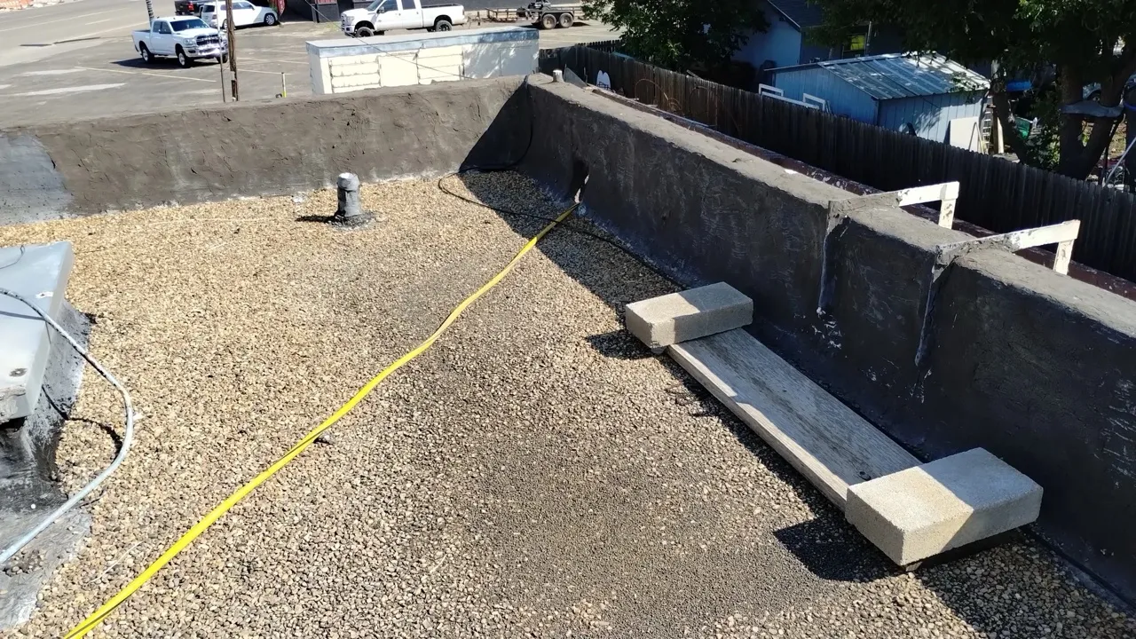 Flat commercial roof during TPO installation showing membrane surface — 5 Star Roofing