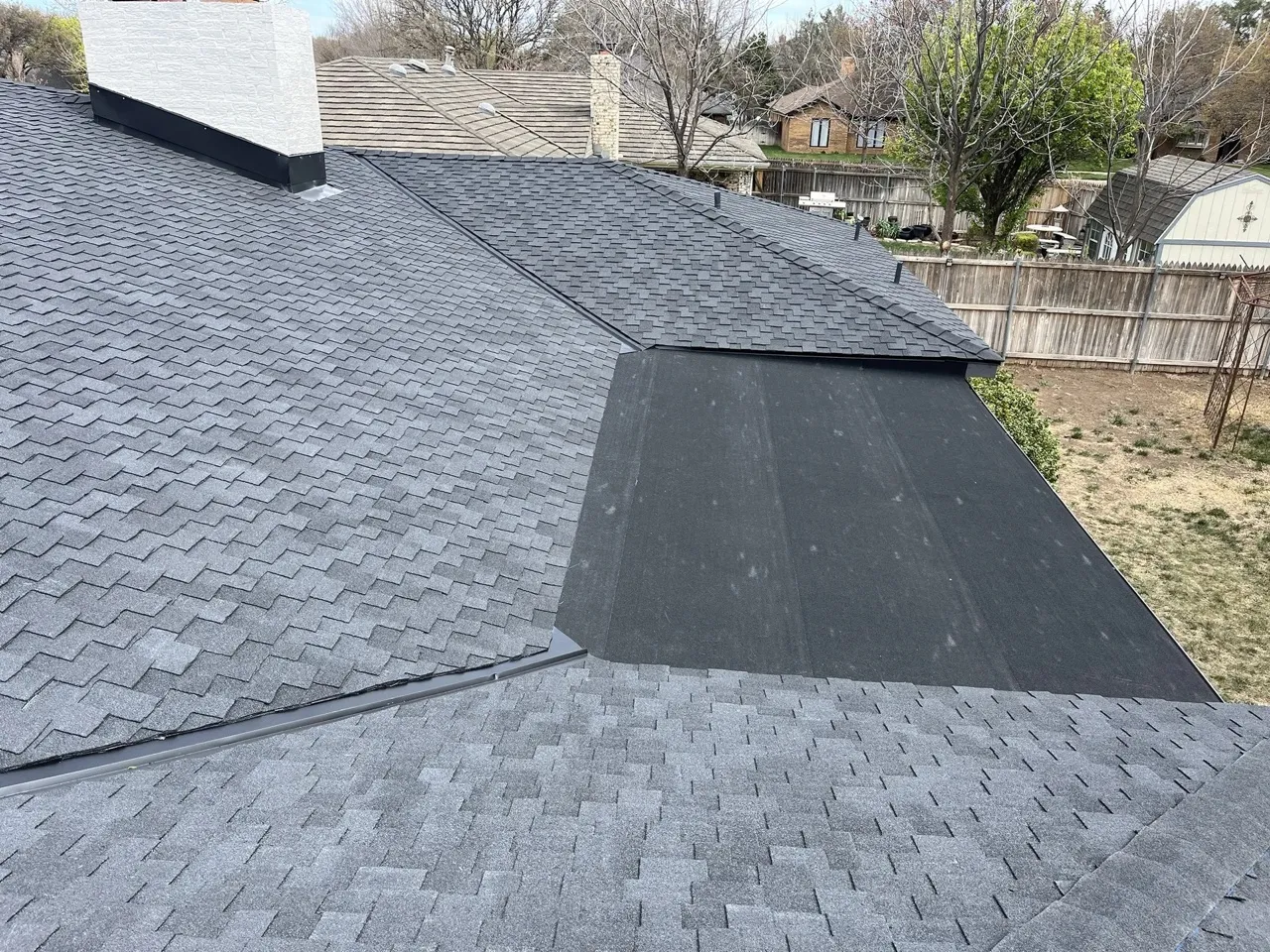 Newly installed gray asphalt shingle residential roof showing clean valley work and ridge lines — 5 Star Roofing