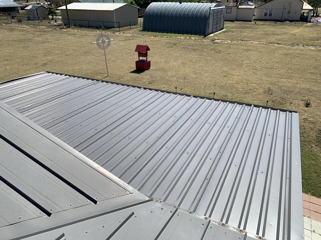 Completed r-panel metal roof in Channing, TX by 5 Star Roofing