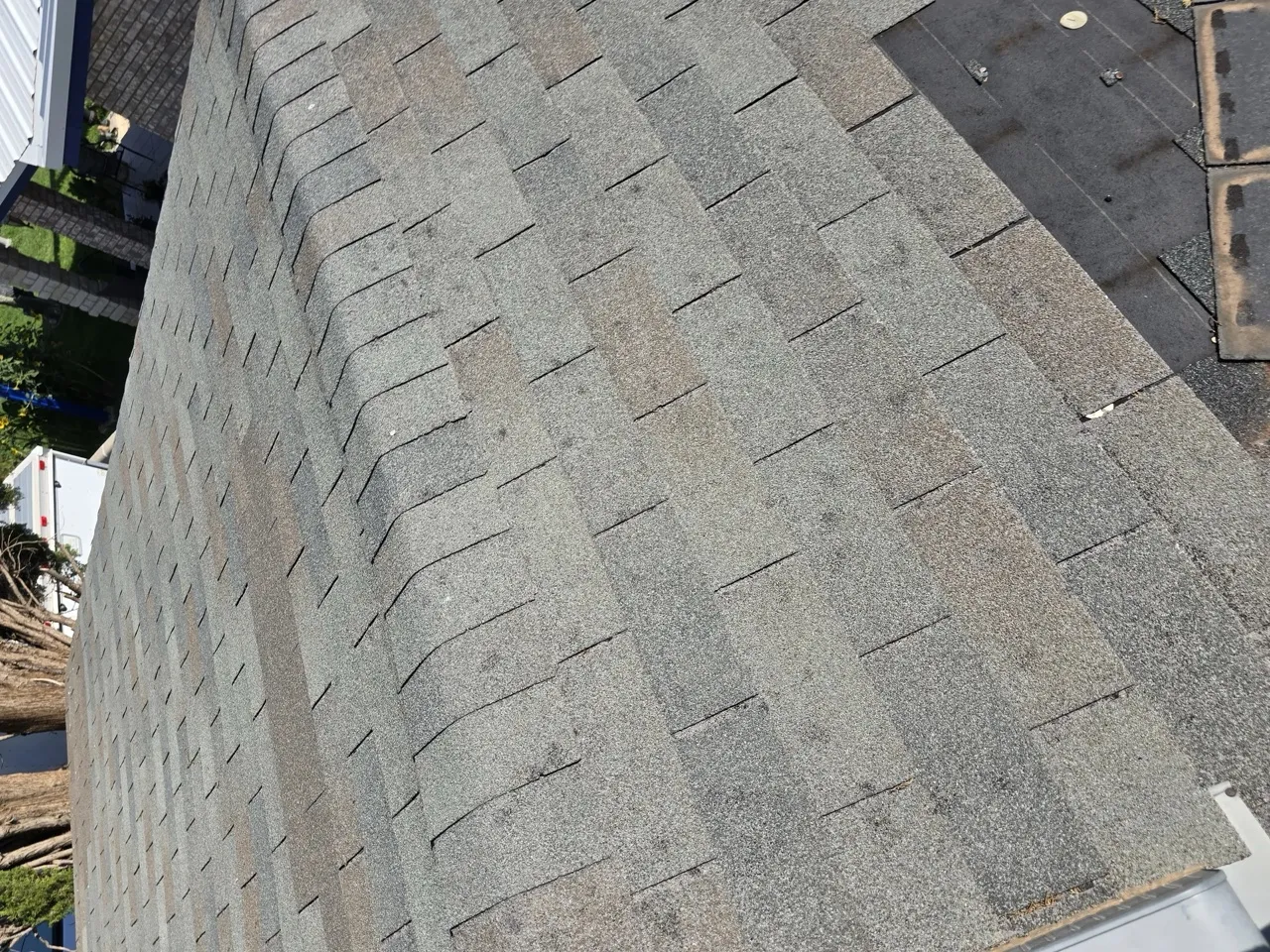 Aerial view of a completed residential roof replacement with gray asphalt shingles in Odessa — 5 Star Roofing
