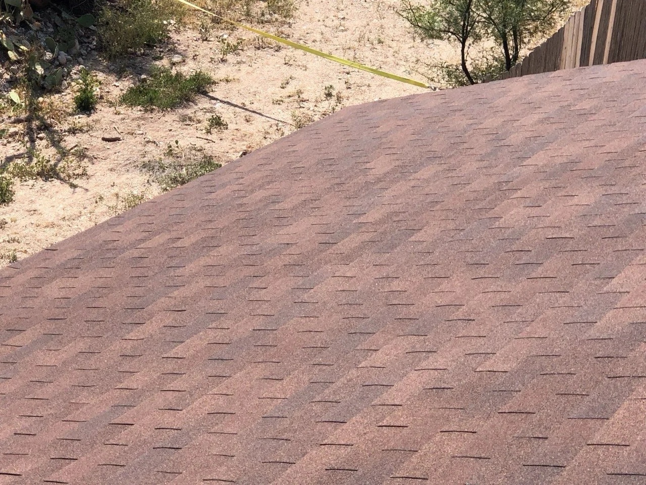 Completed asphalt shingle roof showing the finished surface installed over a sound structural deck