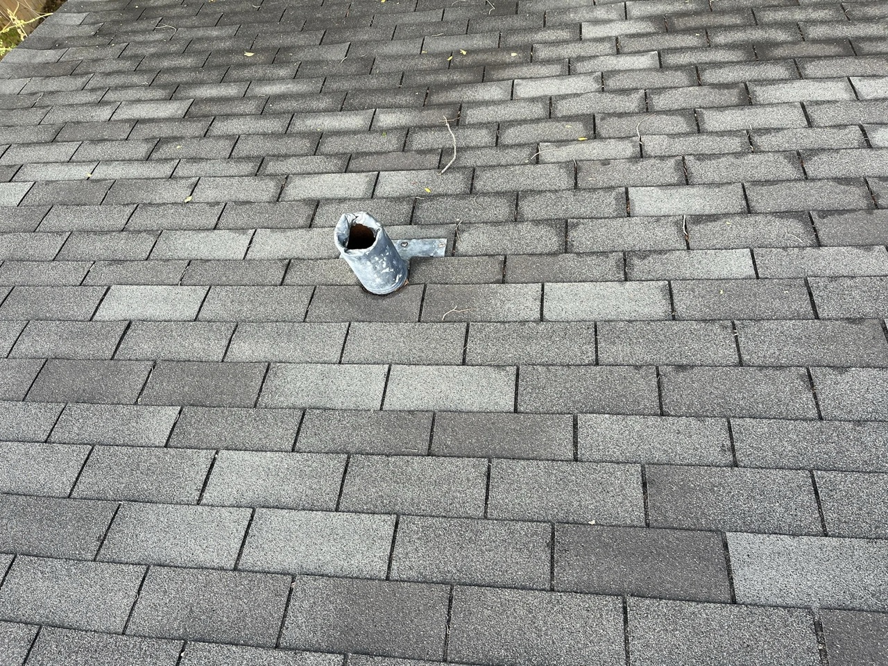 Professional roofing crew installing residential shingles in Amarillo TX at sunset